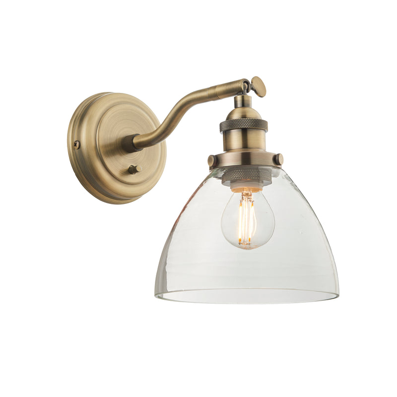 Hansen Wall Light in Antique Brass with Clear Glass Shade – Industrial Resto-Style Adjustable Wall Sconce with On/Off Toggle Switch.