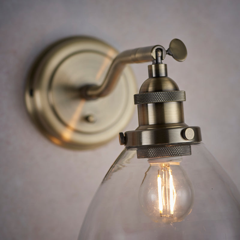 Hansen Wall Light in Antique Brass with Clear Glass Shade