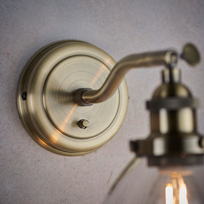 Hansen Wall Light in Antique Brass with Clear Glass Shade