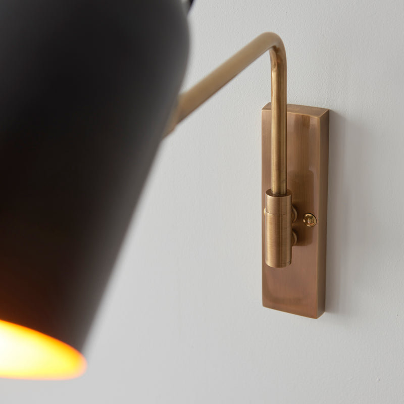 Navren Swing Arm Wall Light in Antique Brass & Matte Black Shade